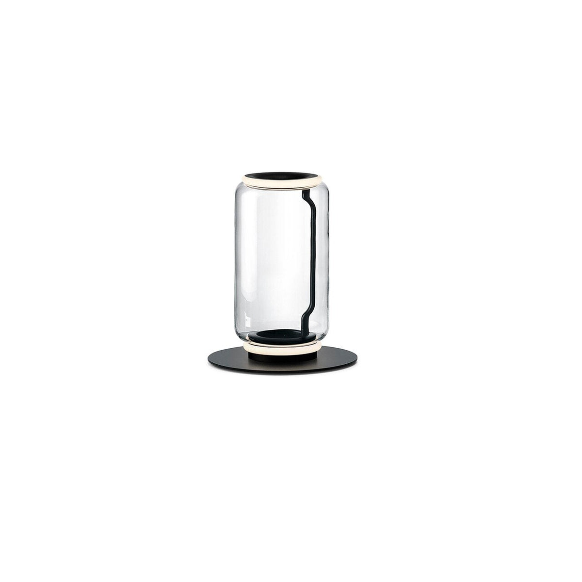 Single-cylinder Clérachic floor lamp on white, a clear glass drum with a glowing ring on a round black base.