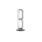 Two-cylinder Clérachic floor lamp on a white backdrop, clear glass drums joined by a glowing ring on a round black base.