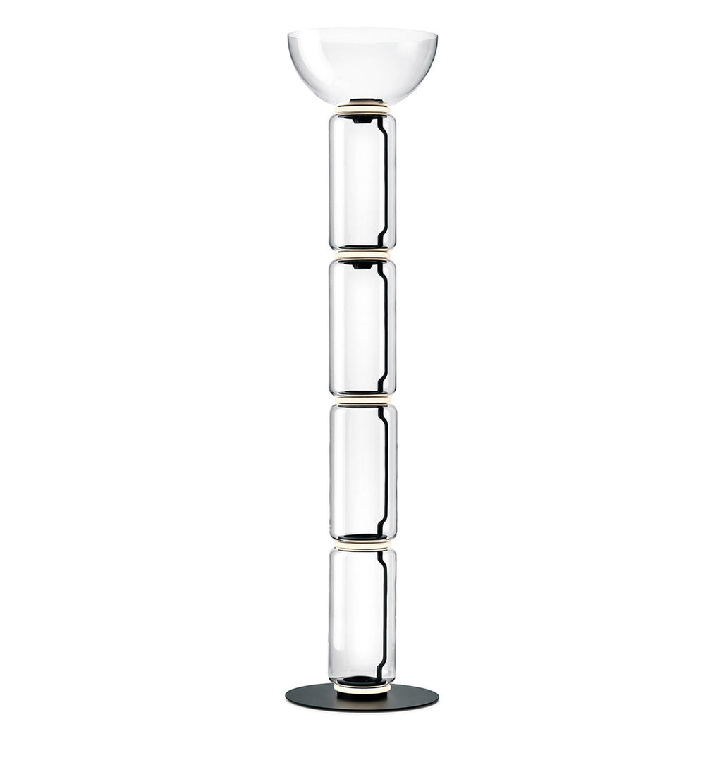 Tall Clérachic floor lamp on white, four stacked glass cylinders under a shallow glass bowl, on a round black base.