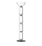 Tall Clérachic floor lamp on white, four stacked glass cylinders under a shallow glass bowl, on a round black base.