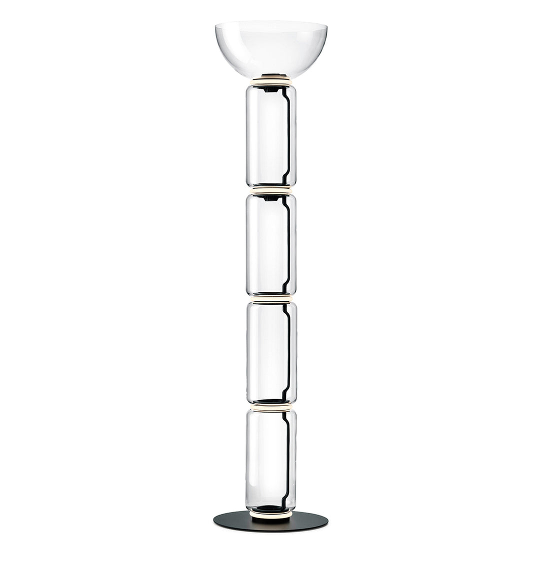 Tall Clérachic floor lamp on white, four stacked glass cylinders under a shallow glass bowl, on a round black base.