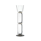 Clérachic floor lamp on white, two clear glass cylinders under a tall flared glass top, on a round black base.