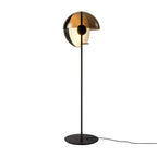 Close view of the black Clérachic floor lamp, the bronze dome open over a pale inner globe, on a plain white background.