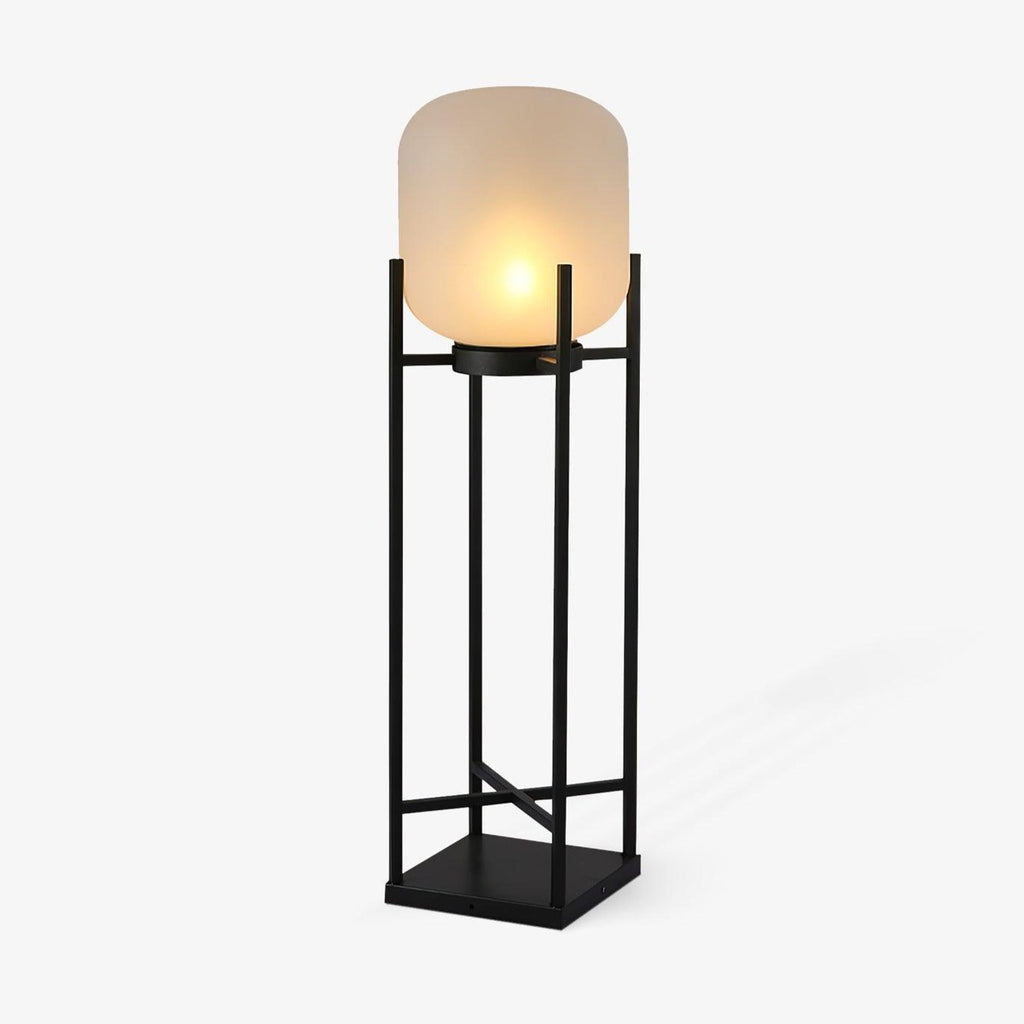 This Clérachic solar floor lantern on a plain white backdrop, with a rounded frosted glass shade on a tall black open frame.