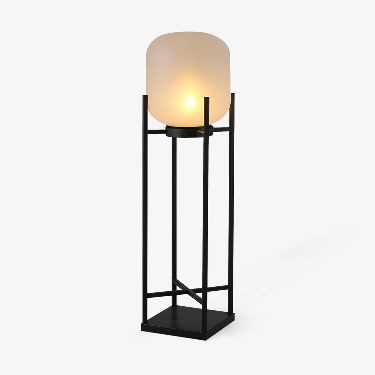 This Clérachic solar floor lantern on a plain white backdrop, with a rounded frosted glass shade on a tall black open frame.