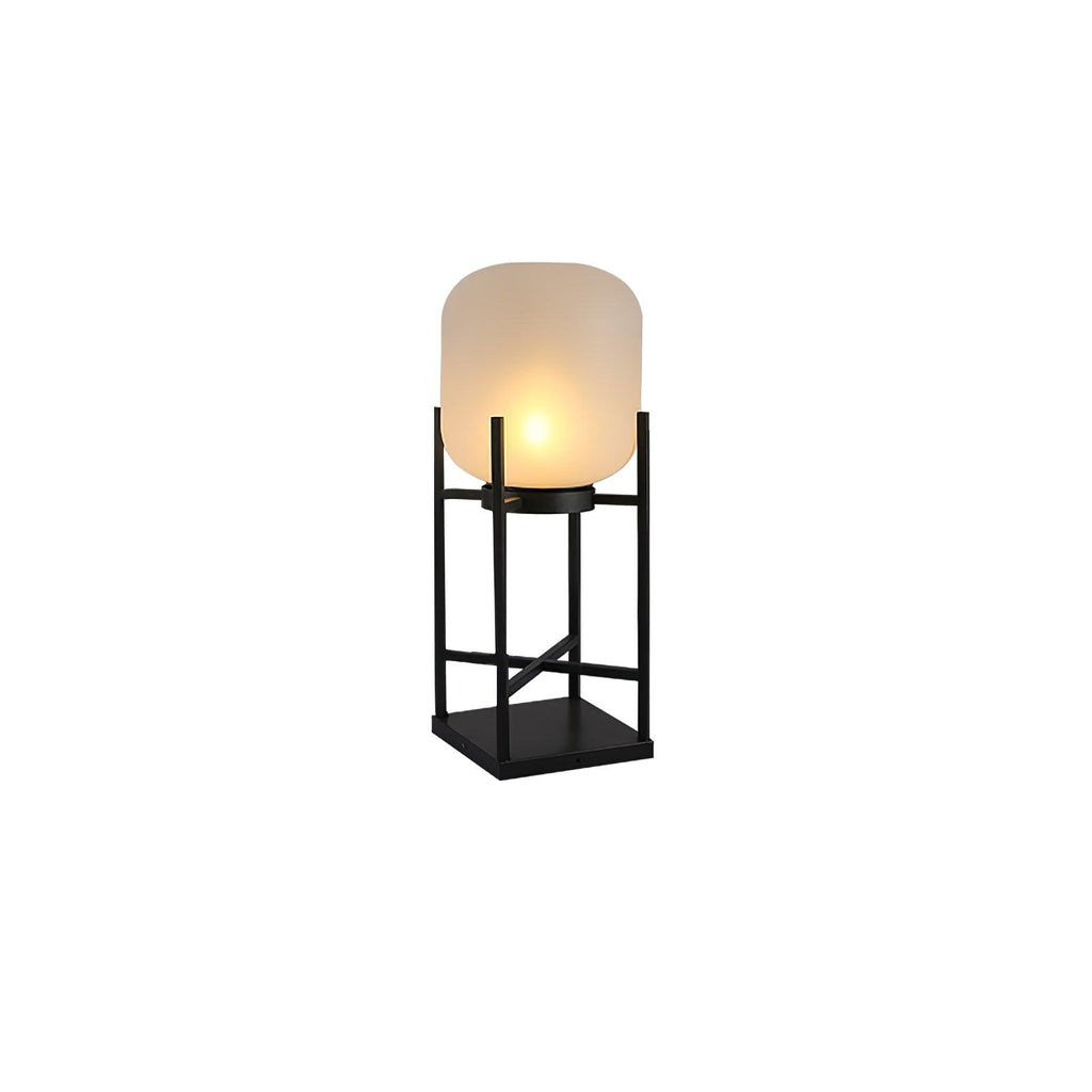 This Clérachic solar lantern on a white background, lit warm inside its frosted glass shade on a black square-based frame.
