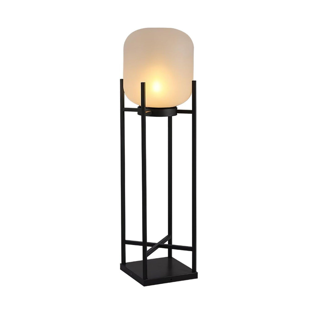 Front view of this Clérachic lantern lit on a white background, with a black four-post frame braced by a cross rail.