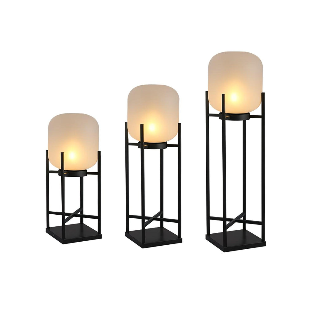 Three Clérachic lanterns in graduated heights, lit and side by side on a white background.