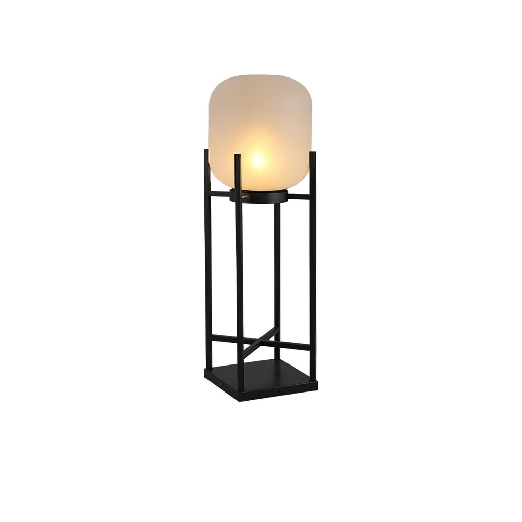 Slightly angled view of a taller Clérachic lantern, lit on a white background, with a black cross-braced frame.