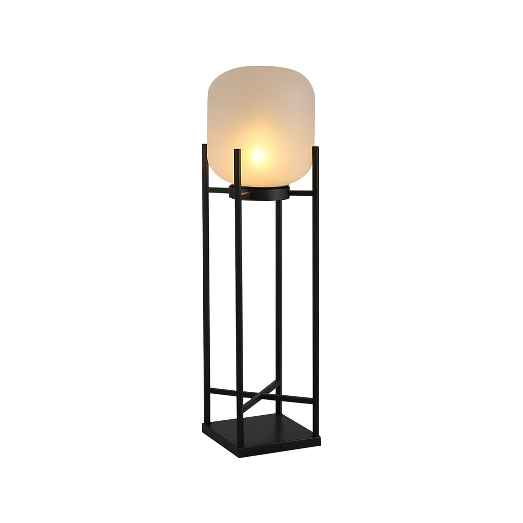 Tall Clérachic lantern lit on a white background, seen at a slight angle, with a frosted shade and square base.