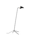 Clérachic black floor lamp with a tripod base, seen from the side on a white backdrop with its cord trailing on the floor.