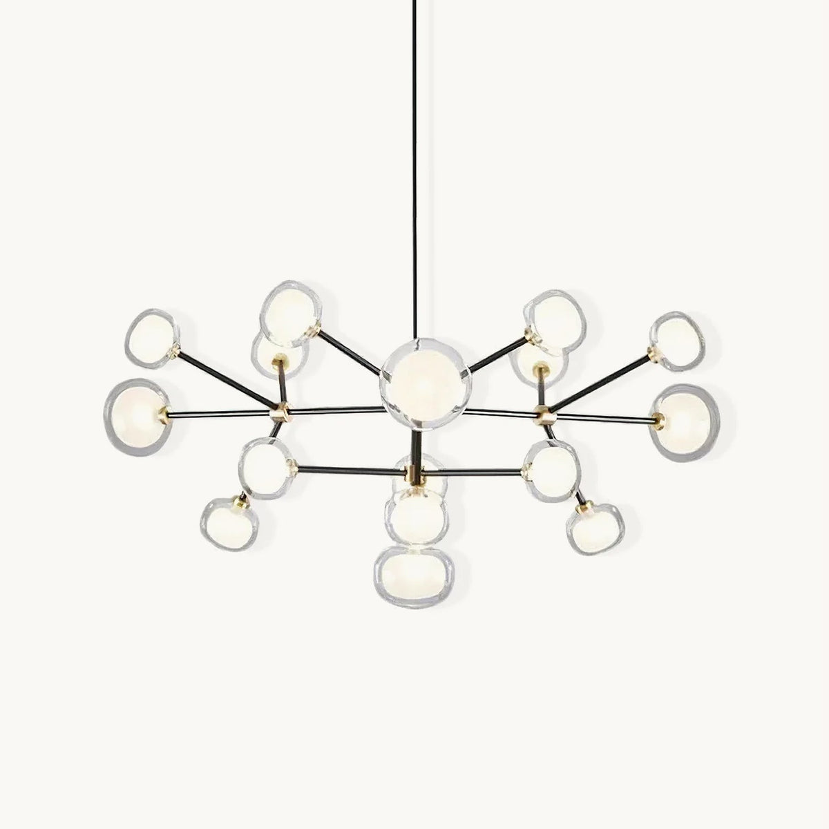 Black-framed Clérachic chandelier on a white backdrop, with brass joints and clear-rimmed glass globes branching from a central stem on a black rod.