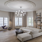 Clérachic glass globe chandelier below a decorative plaster ceiling rose in a living room with taupe curtains, a pale corner sofa and herringbone floor.