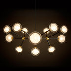 Clérachic chandelier glowing warm against a dark backdrop, with a large central globe and clear-rimmed shades on black arms.