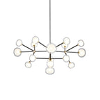 Clérachic chandelier on white, with two tiers of clear-rimmed glass globes on black arms hung from a thin black rod.