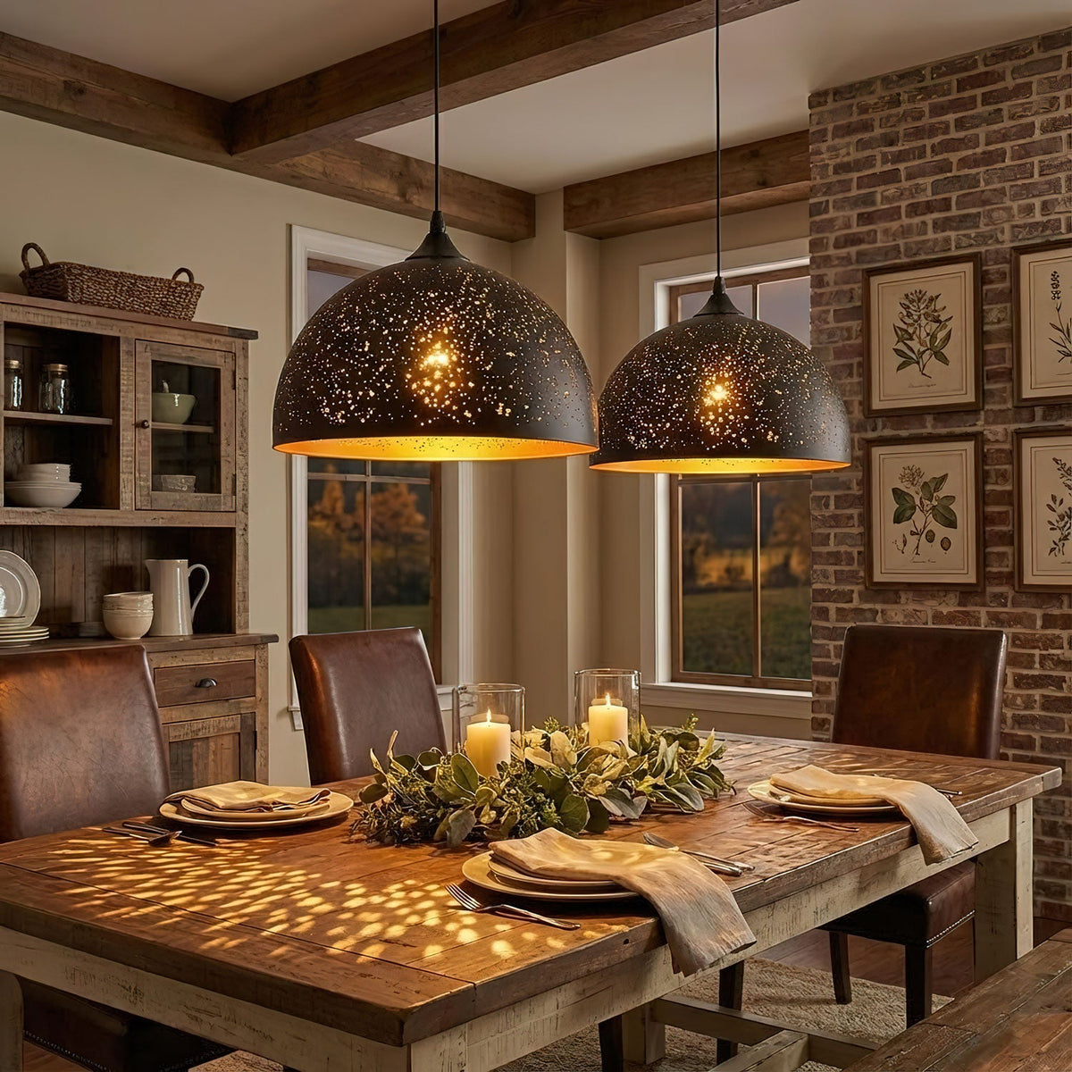 Two wide Clérachic dome pendants above a farmhouse dining table, scattering small spots of light over place settings and a foliage centrepiece.