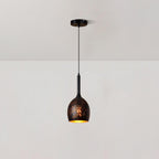 Slim-necked Clérachic pendant with a small egg-shaped black shade, hanging from a ceiling plate against a plain white wall.