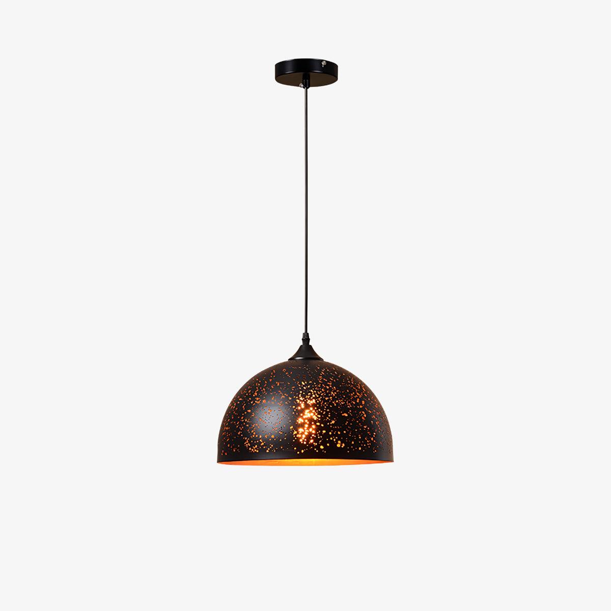 Clérachic dome pendant with a black perforated shade, hanging from a ceiling plate on a thin cord against a plain white backdrop.