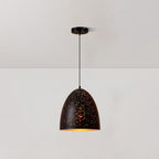 Tall bell-shaped Clérachic pendant with a perforated black shade, hanging from a ceiling plate against a white wall.
