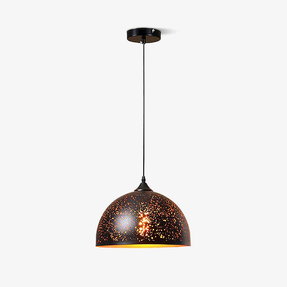 Large dome Clérachic pendant with a perforated black shade and a gold rim, hanging from a ceiling plate on a pale backdrop.
