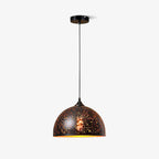 Large dome Clérachic pendant with a perforated black shade and a gold rim, hanging from a ceiling plate on a pale backdrop.