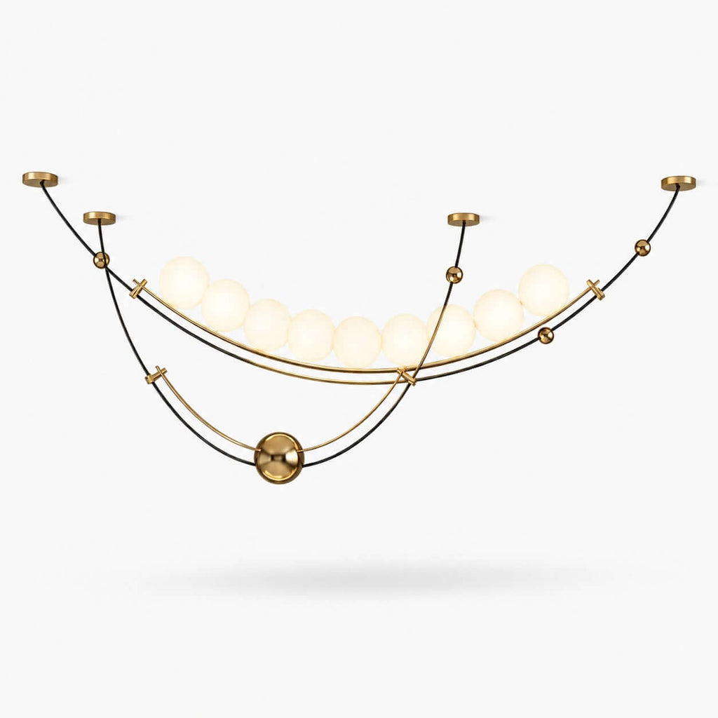 This Clérachic pendant on a plain white backdrop, a row of lit white globes cradled in black and gold curved arcs with a brass ball.