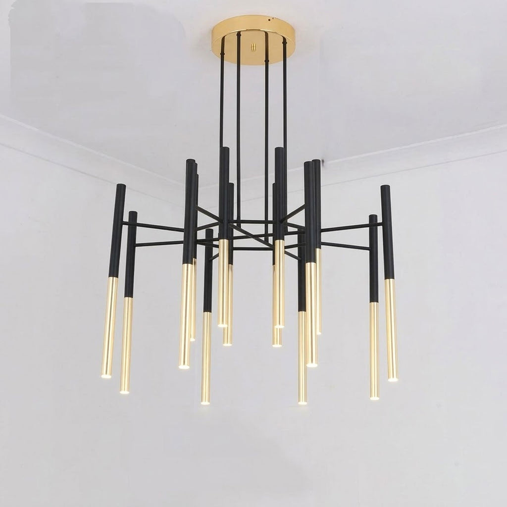 This Clérachic chandelier hangs from a brass-finish canopy, its black rods fanning out from the centre, in a plain white room.