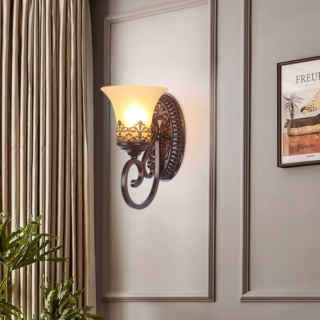 A single-arm Clérachic wall lamp with a glass bell shade on an oval backplate, set on a panelled wall beside striped curtains.