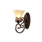 Side view of a single-arm Clérachic wall lamp on white, the scrolled arm curving below its lit bell shade.