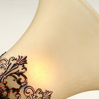 Close view of the frosted cream glass of this Clérachic lamp shade, lit from within, with part of the filigree band below.