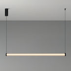 A Clérachic linear pendant lit on a grey backdrop, hung level from two thin cables, with a black cylinder canopy on the left.