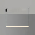 A Clérachic linear pendant lit warm on a two-tone grey wall, hung level from two cables with a black canopy on the left.