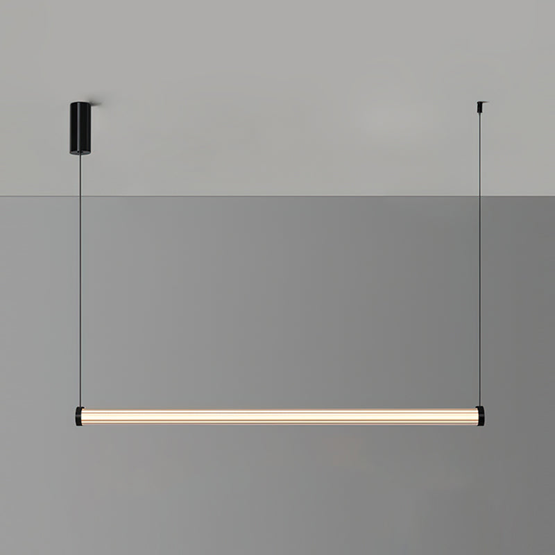 This Clérachic linear pendant on a two-tone grey backdrop, its lit tube running between two thin cables beneath a black canopy.