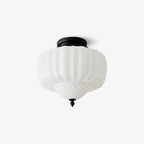 Ceiling light from Clérachic with a ribbed white glass shade and black canopy, shown unlit on a light grey backdrop.