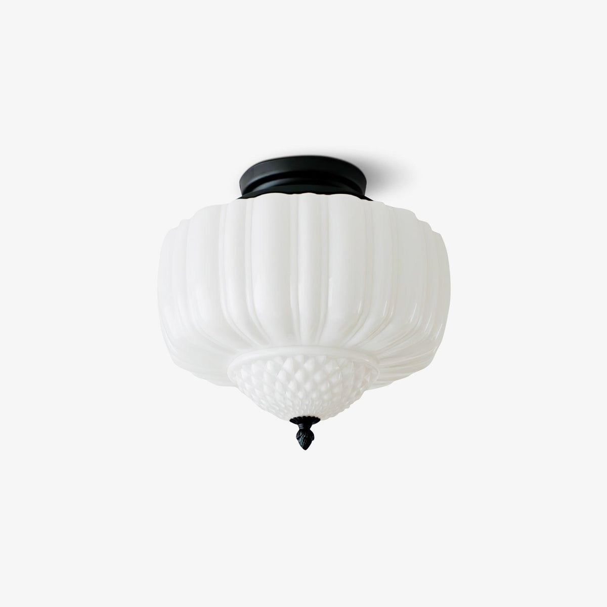 Ceiling light from Clérachic with a ribbed white glass shade and black canopy, shown unlit on a light grey backdrop.