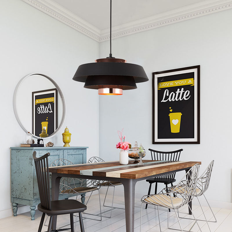 Clérachic pendant light lit, the glow through the shade in a quiet room.