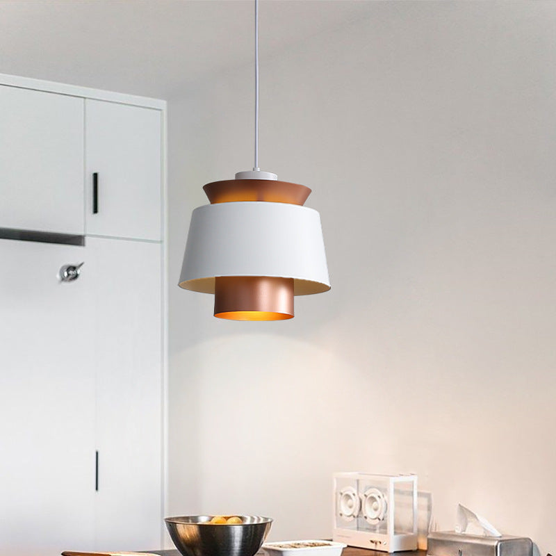 Clérachic pendant light in a room setting over a dining table.