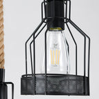 Close view of a black iron mesh cage with an exposed clear filament bulb on this Clérachic pendant light.