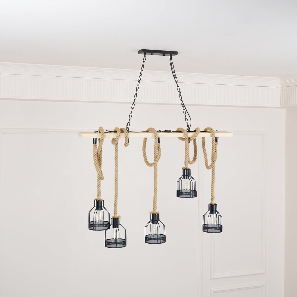 This Clérachic pendant light on its black chains, with five cages hanging at different heights from a pale beam.