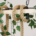 Close view of the pale beam, the thick hemp rope loops and the chain clip on this Clérachic pendant light, with leaves around.