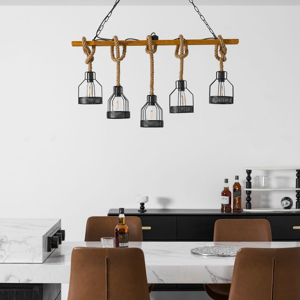 Close crop of a Clérachic pendant light with five caged bulbs on hemp rope, with a marble counter at the bottom of the frame.