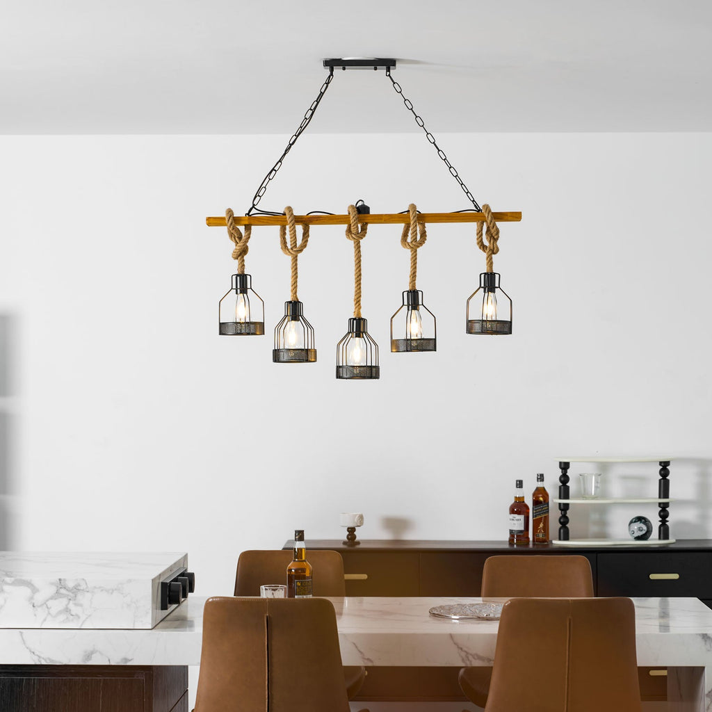 A wooden-beam Clérachic pendant light over a kitchen island, with a black sideboard and a shelf of ornaments behind.
