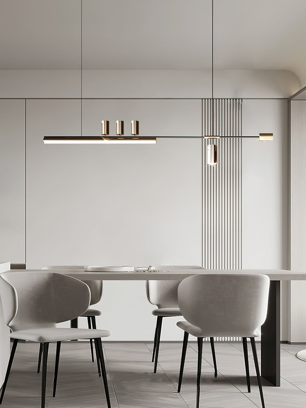 This Clérachic pendant hangs in a pale dining room, centred over a long table with grey upholstered chairs.