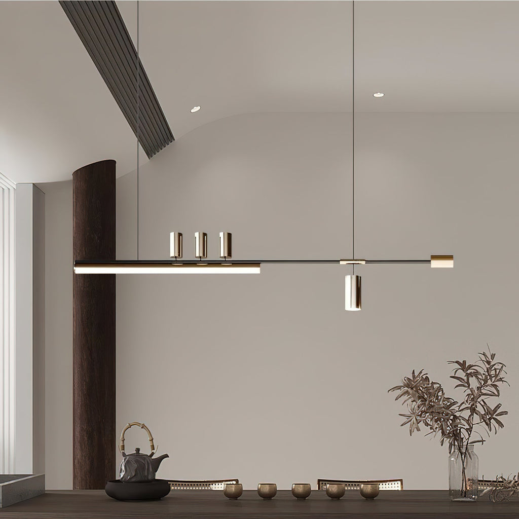 This Clérachic pendant seen in a calm, neutral room with a dark column, a tea set and a vase of dried branches below.