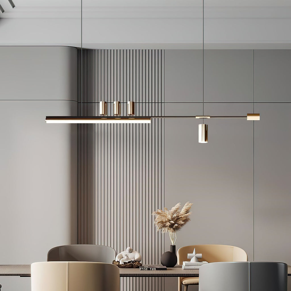 Horizontal LED pendant from Clérachic against vertical wood-slat panelling, with soft chairs and pampas stems on the table.