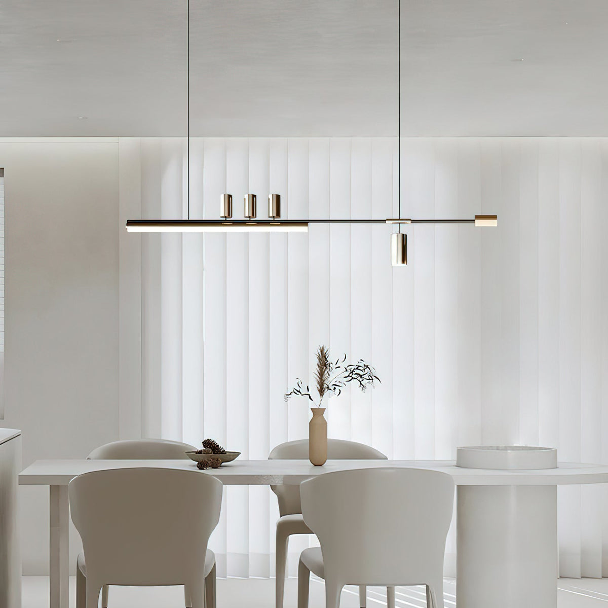This Clérachic pendant glows above a white dining table and cream chairs, with sheer floor-length curtains behind.