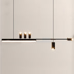 Darker version of this Clérachic pendant, its three black spot heads glowing above a lit bar on a pale wall.