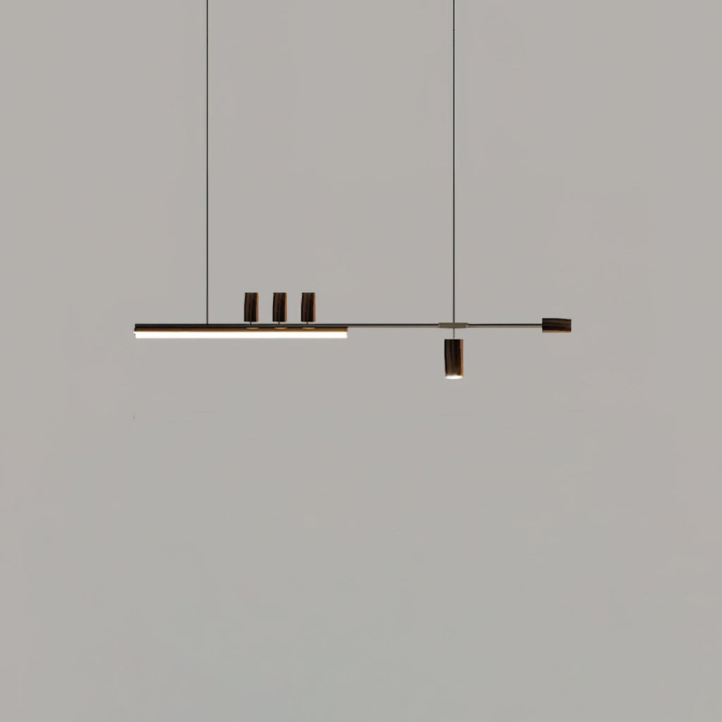 Distant view of this Clérachic pendant on a mid-grey backdrop, its bar lit and the end cap and cylinders in a dark finish.