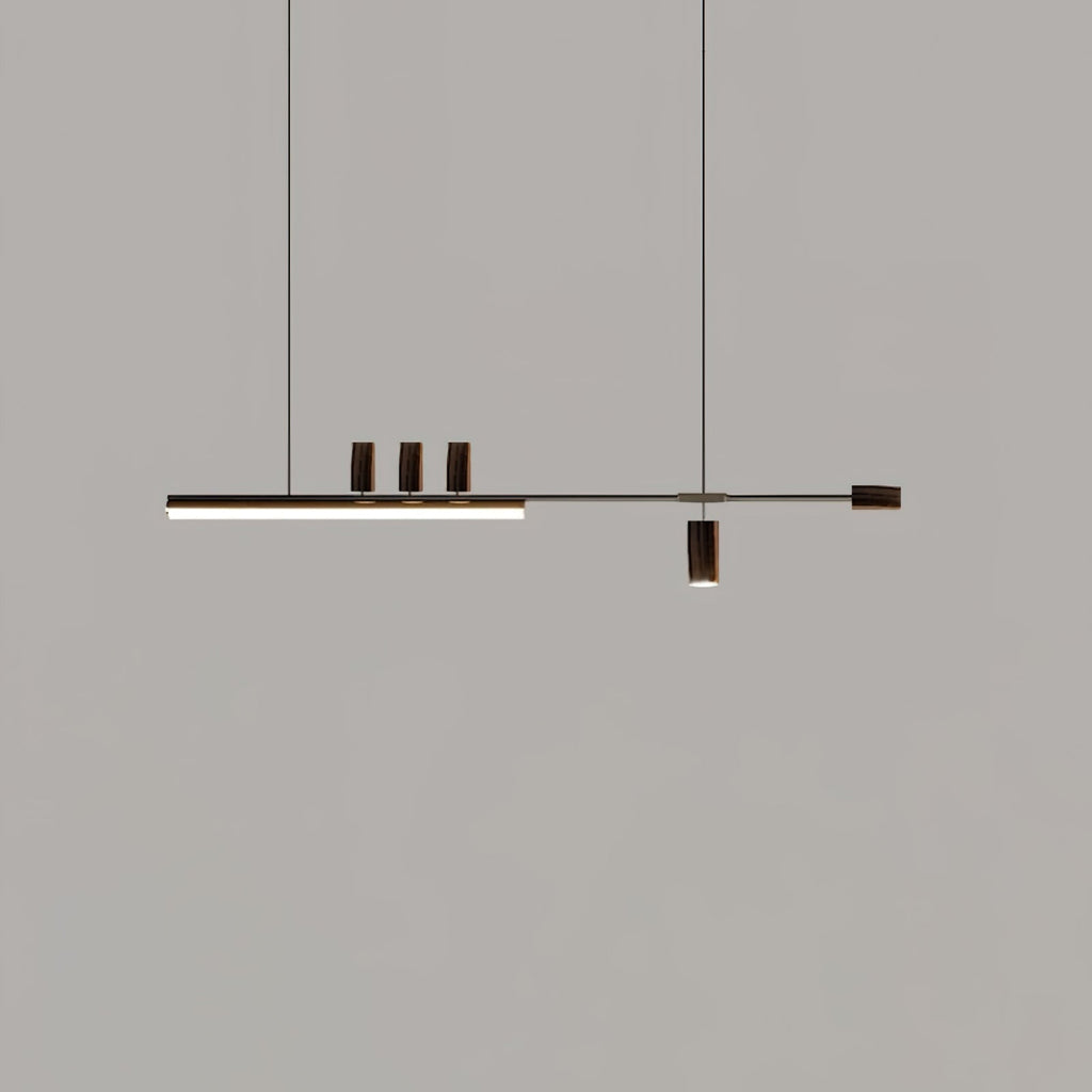 Dark-ended version of this Clérachic pendant against a grey backdrop, its bar lit and three dark cylinders on top.