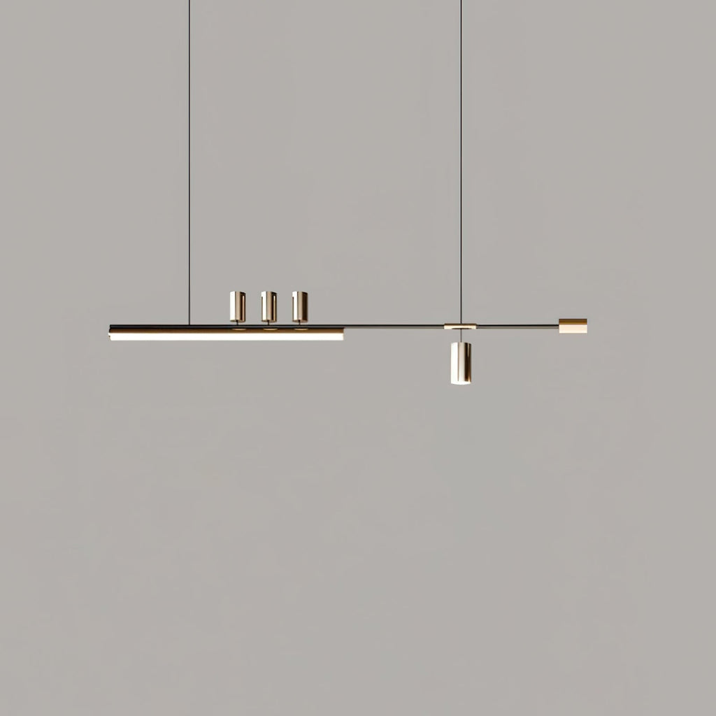 Slim LED bar pendant from Clérachic on a grey backdrop, shown smaller in frame with its cylinders in a soft metal tone.